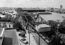 Black and white photograph looking down along the bridge