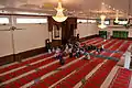 Inside the prayer hall with the three chandeliers, brought from China