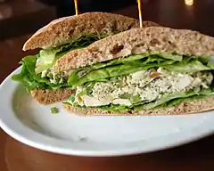 A sandwich prepared with chicken salad