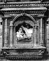 Chittadhar sitting at a traditional window.