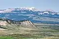 Aerial view of Choteau Mountain centered on horizon, with Guthrie Peak (right)