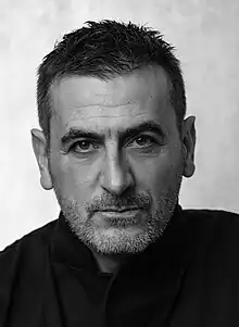 A studio photograph of the actor Chris Gascoyne