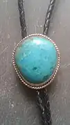 Chrysocolla and silver bolo tie. This chrysocolla specimen is from the Kennecot Copper Mine in Bingham Canyon, West Valley City, Utah.