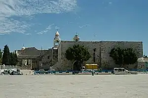 A side view photograph of the Church of the Nativity from Manger Square, taken in 2005.