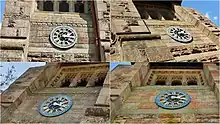 Colour photograph of the four cast iron clock faces. The Roman numerals indicating the twelve hours on each face are coloured gold.