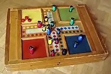 Image 19Parcheesi is an American adaptation of a Pachisi, originating in India. (from Game)