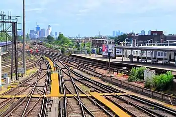 The complex mass of train tracks through Clapham Junction, UK as an analogy of the complex society its infrastructure supports.