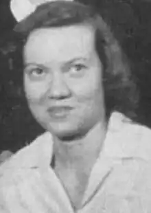 A young white woman with hair brushed back from forehead