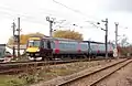 A Class 170 operated by CrossCountry approaching Ely station from the north