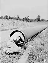 Cleaning the inside of the pipe by hand,