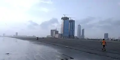 Dolmen City pictured in 2019 under construction, with the under-construction Bahria Icon Tower visible to the right