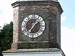 Clock tower and adjoining building about 15m south-west of Calenick House