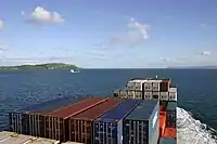 Container ship mv Encounter (built 2004, callsign PHAO) outbound on the Clyde Estuary, destination Bilbao. Little Cumbrae can be seen on the left.