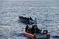 A Robert Yered small boat crew approaches a 30-foot panga vessel with 50 Haitian migrants aboard approximately 46 miles north of Cap Haïtien, Haiti, May 20, 2019.