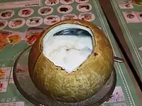 Coconut pudding served in a coconut.