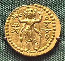 Three-faced Oesho, often identified with Shiva, on a coin of Huvishka