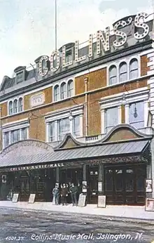 exterior of theatre with red brick façade and elaborate canopy over entrance