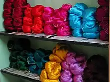 Dyed silk yarns for weaving saris.