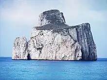 Large, white rocks rising from the sea