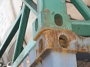 Loosely stacked tank containers, without twistlocks to tie their corners together, illustrating how easily the top one might shift off the bottom one