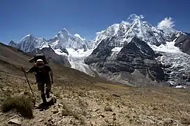 Hiking the Alpine Circuit in the Waywash mountain range. In the background are (L to R) Rasac, Yerupaja, Siula Grande and Sarapo.