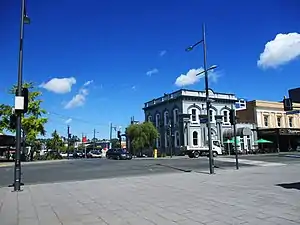 Corner of Hood Street, with the former Bank of New Zealand building in the background