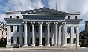 A large, distinguished government building built of white marble or a similar stone