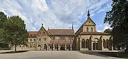 Monastery courtyard with the gothic church on the left and monastery buildings on the right