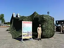 Covered ROCN Hsiung Feng II & Hsiung Feng III anti-ship missile launchers truck displayed at Zuoying Naval Base