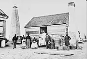 Beacon Tower and "negro cabin", Cockspur Island, Georgia, photographed 1863