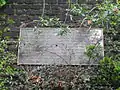 Plaque on the retaining wall commemorating the station