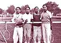 Bảo Đại (right) at the tennis court and his cousin Vĩnh Cẩn (left).