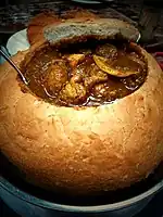 Curry chicken in a big bread provided by a Macao restaurant