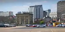 Rear of station building, across former freight depot (now car park), with Masshouse block M behind