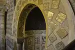 Detail of the mihrab, showing the square luster tiles around the upper section