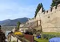 Durnstein an early wall without gun slots in the crenellations and with "putlog" holes to carry the walkway.