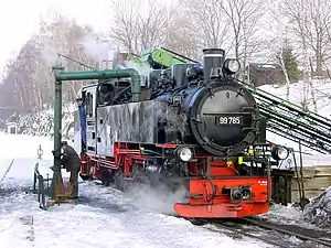 Steam engine 99 785 at the water crane in the Cranzahl station