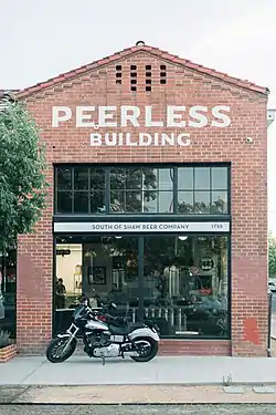 The red-brick front facade of the Peerless Building