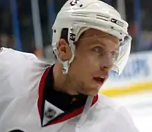 Man's head wearing hockey helmet