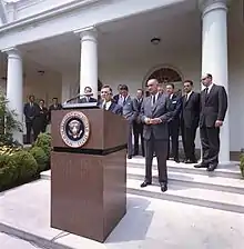  In this photo, David Rockefeller takes the podium as President Lyndon Johnson looks on in the White House Rose Garden on June 15, 1964, to announce the launch of the International Executive Service Corps.