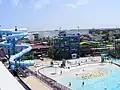 Second view from Southeast corner of waterpark showing Blackbeard's Revenge (closer), 3-slide Poseidon's Pass complex (center) and Adventure Mountain (distant)