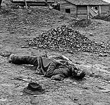 Confederate artilleryman killed during the final Union assault against the trenches at Petersburg. Photo by Thomas C. Roche, April 3, 1865. Although prints of this picture list it as being taken at Ft Mahone, historians at the "Petersburg Project" believe it was taken at Confederate Battery 25