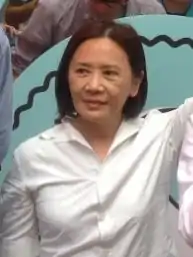 Deanie Ip in 2016 looking to the left, wearing a white blouse