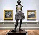 Little Dancer of Fourteen YearsCast posthumously in 1922 from a mixed-media sculpture modeledc. 1879–1880BronzePartly tinted, with cotton skirt and satin hair ribbon, on a wooden baseMetropolitan Museum of ArtNew York City