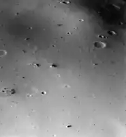 The surface of Deimos, a moon of Mars, is covered by a layer of regolith estimated to be 50 m (160 ft) thick. Viking 2 orbiter image is from a height of 30 km (19 mi).