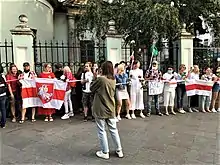 Belarusian opposition supporters holding flags with Vytis (Pahonia) during the 2020–2021 Belarusian protests