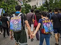 Protest artworks attached to backpacks, August 2019. The Chinese words mean "Guard the future."