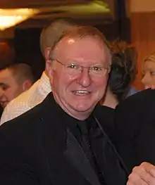 Dennis Taylor, smiling at the camera