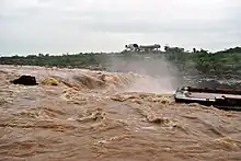 Side view of the Dhuandhar Falls seen during the monsoon season.