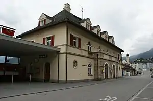 Three-story building with hip roof and dormers